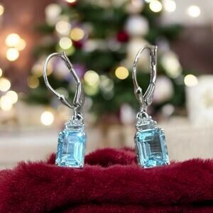 Woman’s sterling silver 3.20 CTW topaz designer earrings